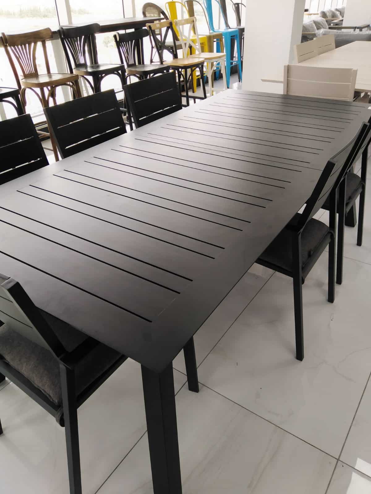 שולחן אלומיניום איקס לבן נפתח סוסיאדד 100x216/297 כולל 6 כסאות מעצבים